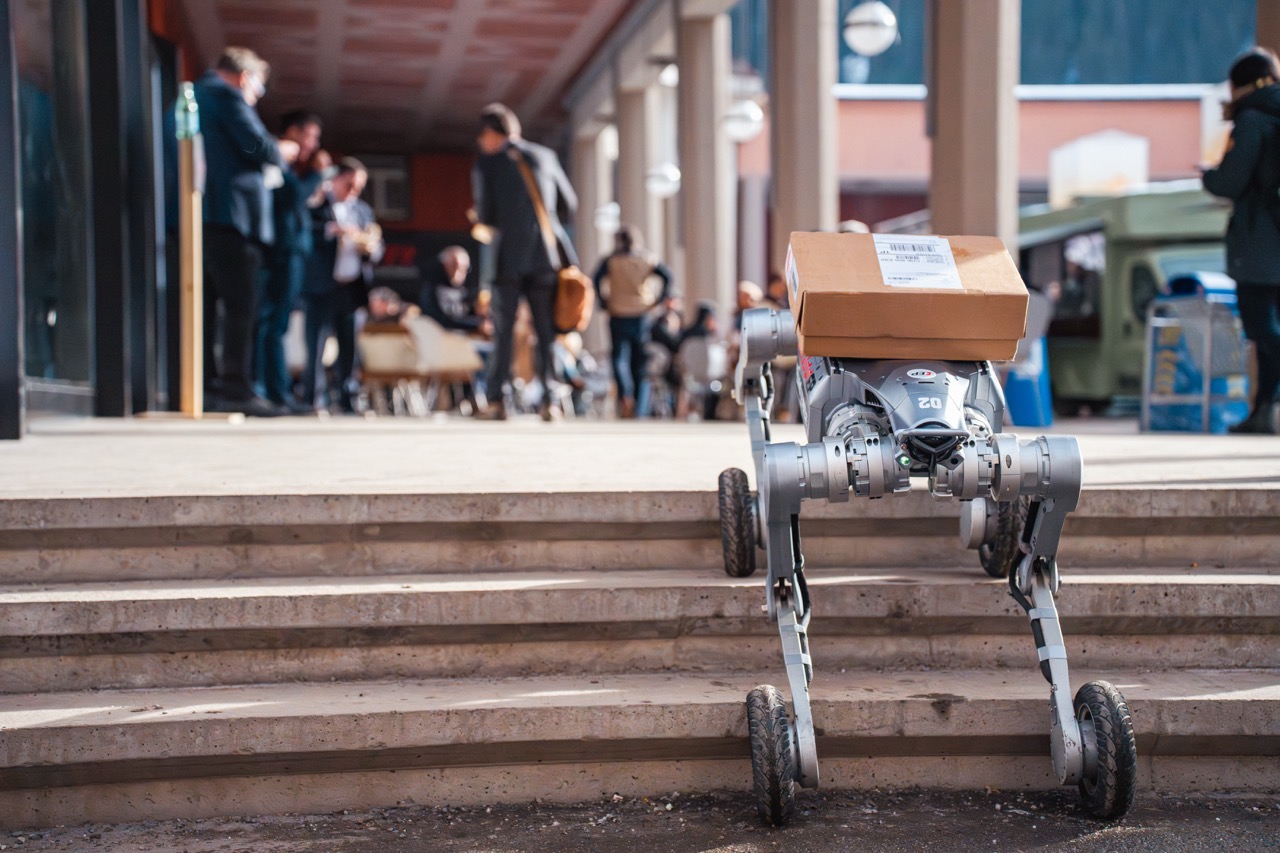 Robot carrying a package on stairs